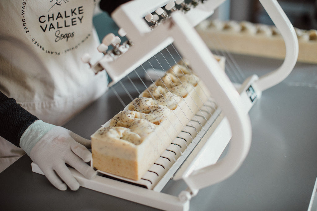 Multi cutting of a citrus soap loaf into large soap bars