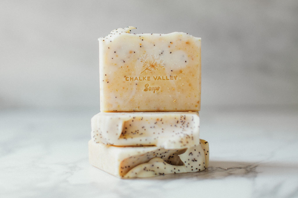Three bars of soap stacked on a marble surface with 'Chalk Valley Soaps' branding.